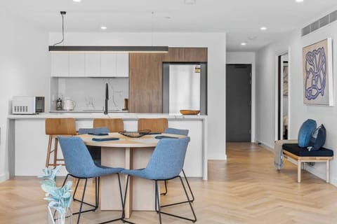 Next to the kitchen is a four-seater dining area for enjoying meals at home when staying in. 