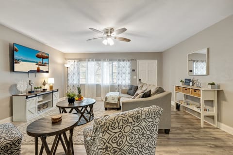 Bask in the natural glow from the expansive window, strategically placed to flood the living room with abundant natural light.