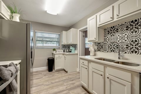 The modern appliances stand ready to assist in creating culinary wonders.