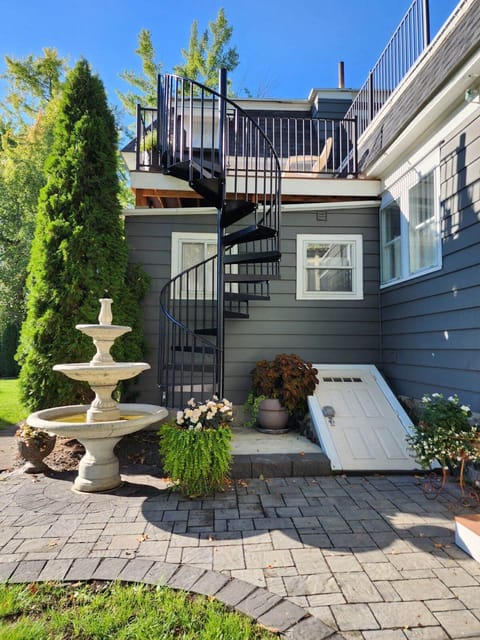 Spiral staircase up to private deck and entrance to rental unit.