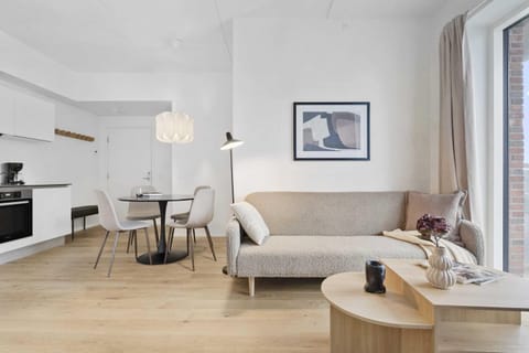 Cozy living room to unwind and relax with direct access to private balcony