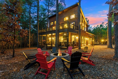 Firepit, back patio and back deck nestled amongst the trees