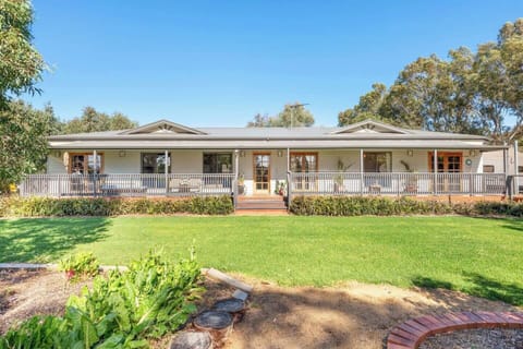 The large family home is nestled among acres of landscaped gardens offering a tranquil, quiet setting.
