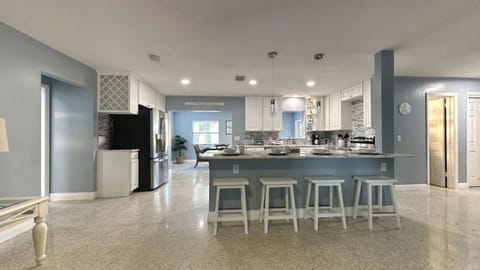 Kitchen area: central island with 4 bar stools,Refrigerator,stove,oven&many more