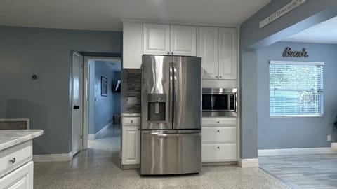 Kitchen area: central island with 4 bar stools,Refrigerator,stove,oven&many more