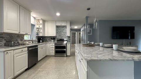 Kitchen area: central island with 4 bar stools,Refrigerator,stove,oven&many more