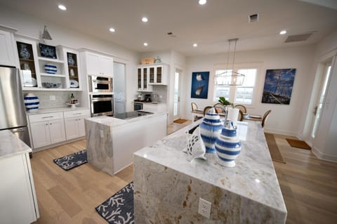Large custom kitchen with 2 islands and 4 stools