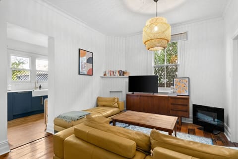 The bright and spacious living room offers a cosy haven to kick back, unwind, and enjoy some quality down time.
