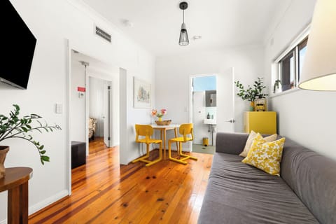 Settle into the compact living area, where a comfortable sofa, smart TV and playful contemporary touches create a cosy spot for your favourite series.