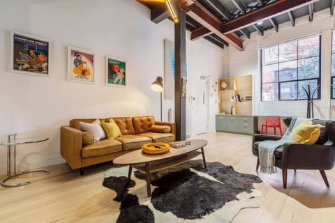 The living area is kitted out with eclectic decor and a mix of mid-century furniture and vintage finds.
