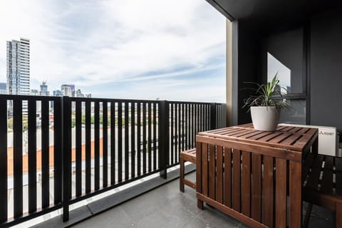 Staying in? Choose to dine al fresco on your private balcony against a backdrop of Melbourne CBD views