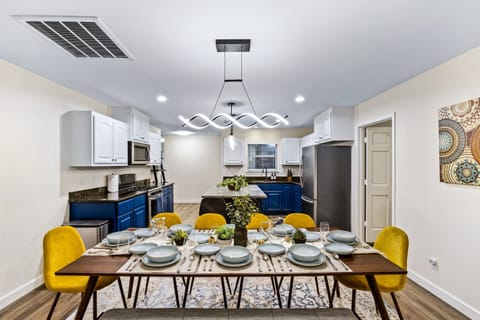 Extra large dining table plus plenty of chairs (2 more chairs not shown here available to be added to the table)