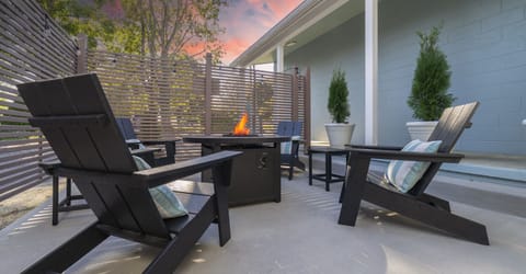 Cozy evening on the patio with the fire pit lit — perfect for relaxing under the stars and enjoying unforgettable nights.