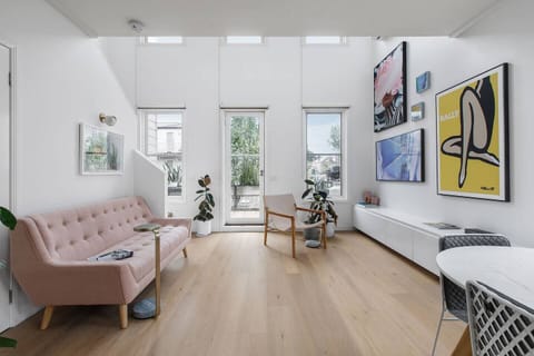 A stylish plush sofa sits in the brightly lit living room where you can kick back and relax.
