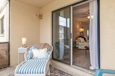 Screened porch with seating and access to common area/backyard