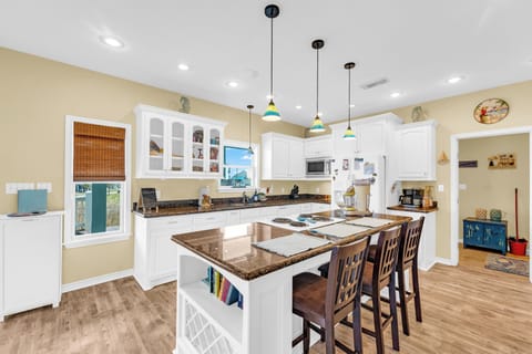 Coastal charm meets modern convenience in this breezy kitchen.