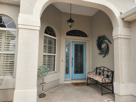 East facing cozy and colorful entrance.  Great spot to read the morning paper.