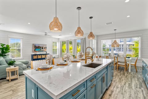 From the island, enjoy open views of the dining table and plush living space beyond — everything flows together.