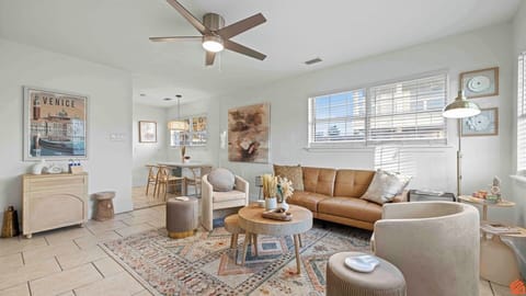 Cozy up in a sunlit space with comfortable seating.