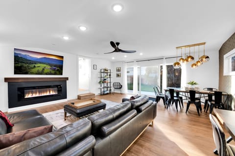 Unwind in a massive living room with a 75-inch TV and fireplace