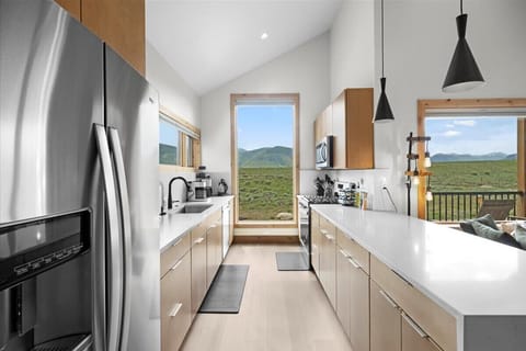 The kitchen has stainless gas appliances.