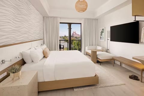 Wake up to breezy balcony views from this spacious, elegant room.
