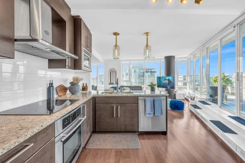 Facing out into the living room and the lower balcony to the right. 