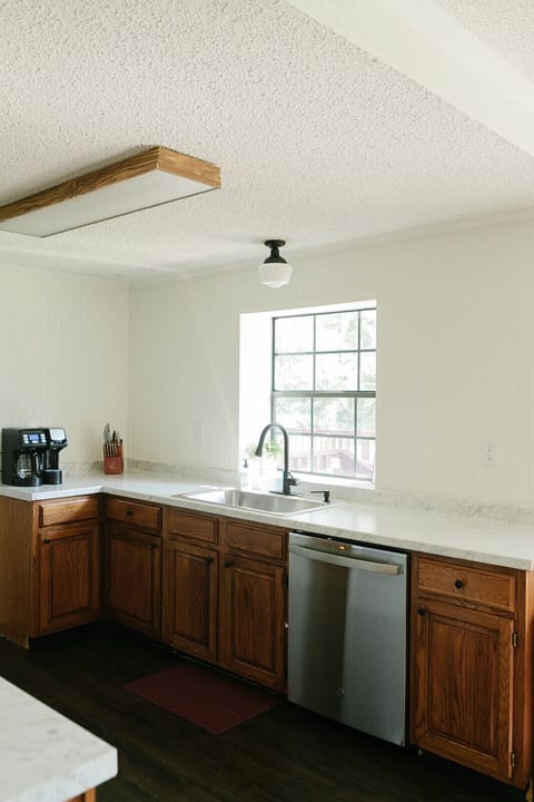 Sink side of kitchen overlooking the front lawn.