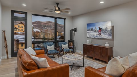 Great Room, Main Level - Cozy living room with gas fireplace and main level deck access