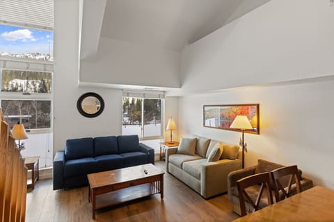 Your bright living space features vaulted ceilings and mountain views, perfect for unwinding after adventures.