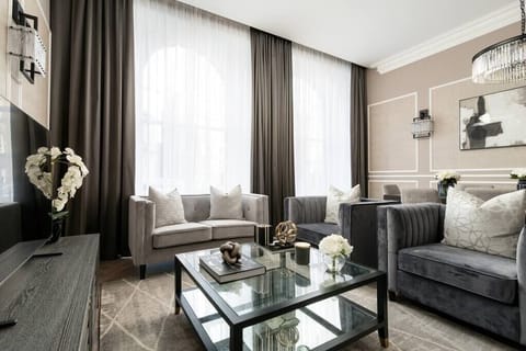 The modern smart TV is set up so you can see it from every angle of the spacious open-plan living area.