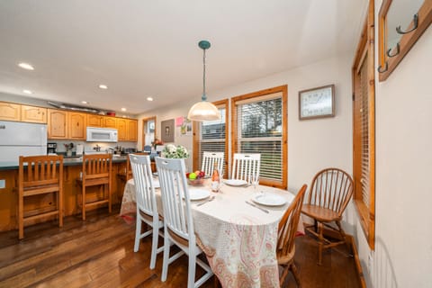 Dining room table seats 6, open to living room and kitchen with breakfast bar with seating for 4
