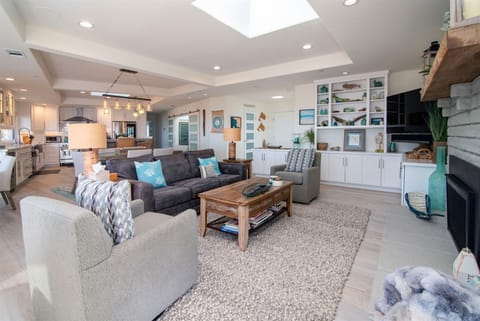 Plenty of seating options in the living room plus large Smart TV