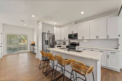 Large pantry and back yard access directly off the kitchen.  There are also dog doors that feed through the garage for those who come with pets.