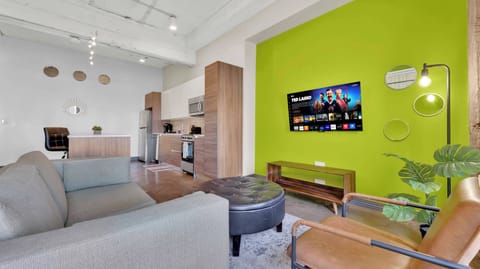 Stylish retreat with urban flair, sleek furniture, and modern entertainment setup!