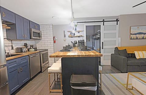Completely renovated kitchen with beautiful butcher block countertops and island with seating for eight people.