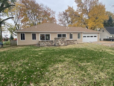 Back of house with stamped concrete patio including future grill.