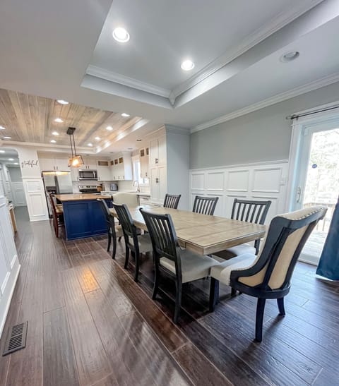 8 seat dinner table, with 3 extra bar seats. 
