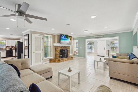 Living room with plenty of seating for the family and large UHD Smart TV