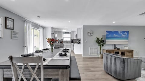 Gather around a spacious dining table that comfortably seats eight for a memorable meal together.