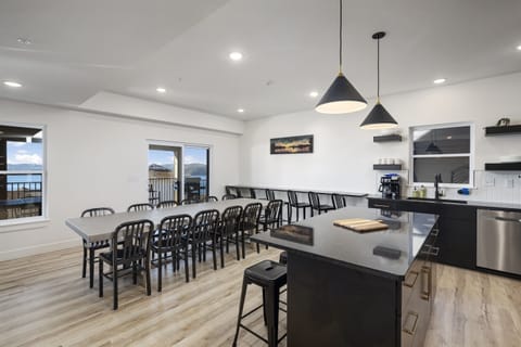 Tree House - Main Level: Kitchen and Dining Room seating 21 (12 at Dining Table and 9 on bar stools)