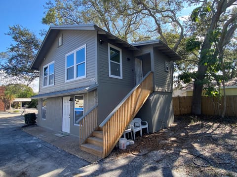 Stairway to upper unit of duplex and side yard is now fenced
