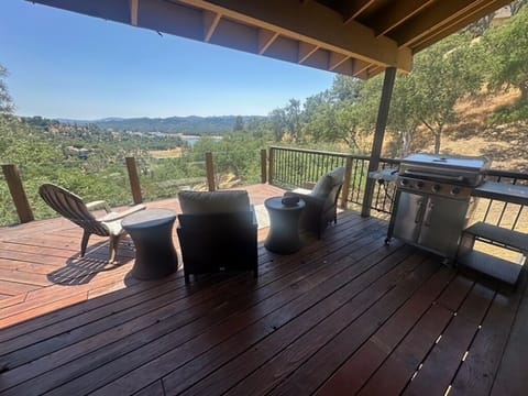 Upper deck, off of kitchen. Propane BBQ.