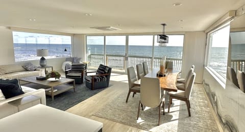 Front room and dining room with a 270 degree view of the beautiful ocean