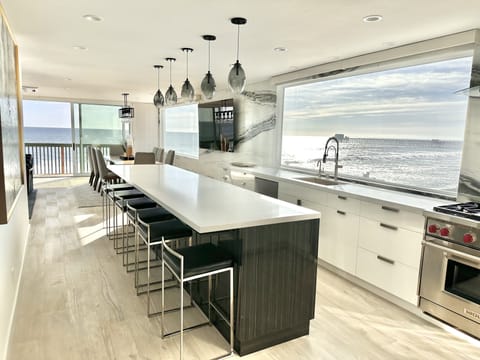 Kitchen island and dining room with seating for 14 for dinner!