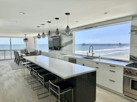 Kitchen with island (6) seats, looking north, into the ocean, park and into town