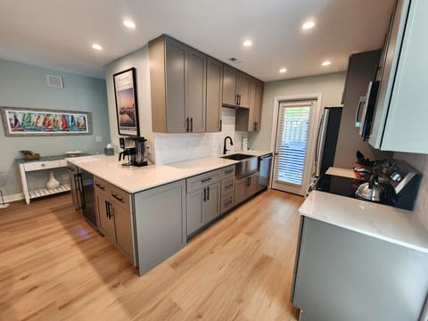 Updated kitchen with extended countertop and dedicated beverage area