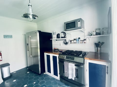 Full size fridge in kitchen with water/ice dispenser