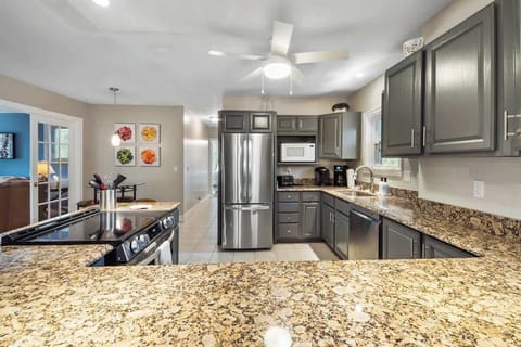 Large refrigerator and counter top stove.