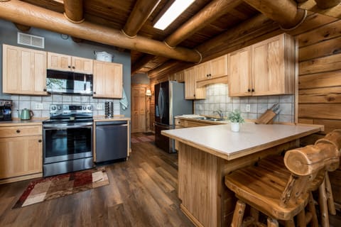 Fully stocked and updated kitchen with a 3 seat eat-in kitchen island.